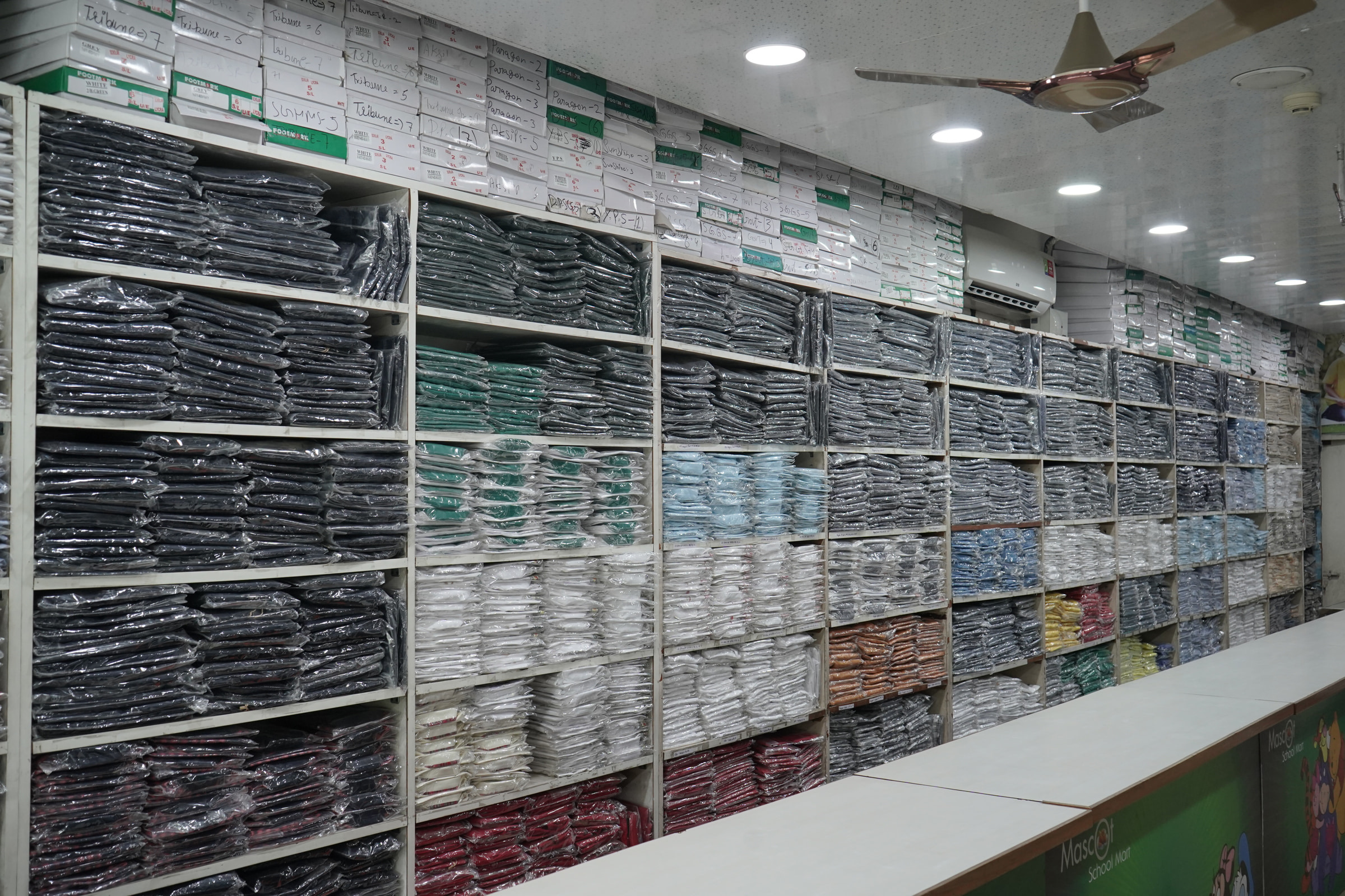 Uniform stacked wall to ceiling at Sector 35