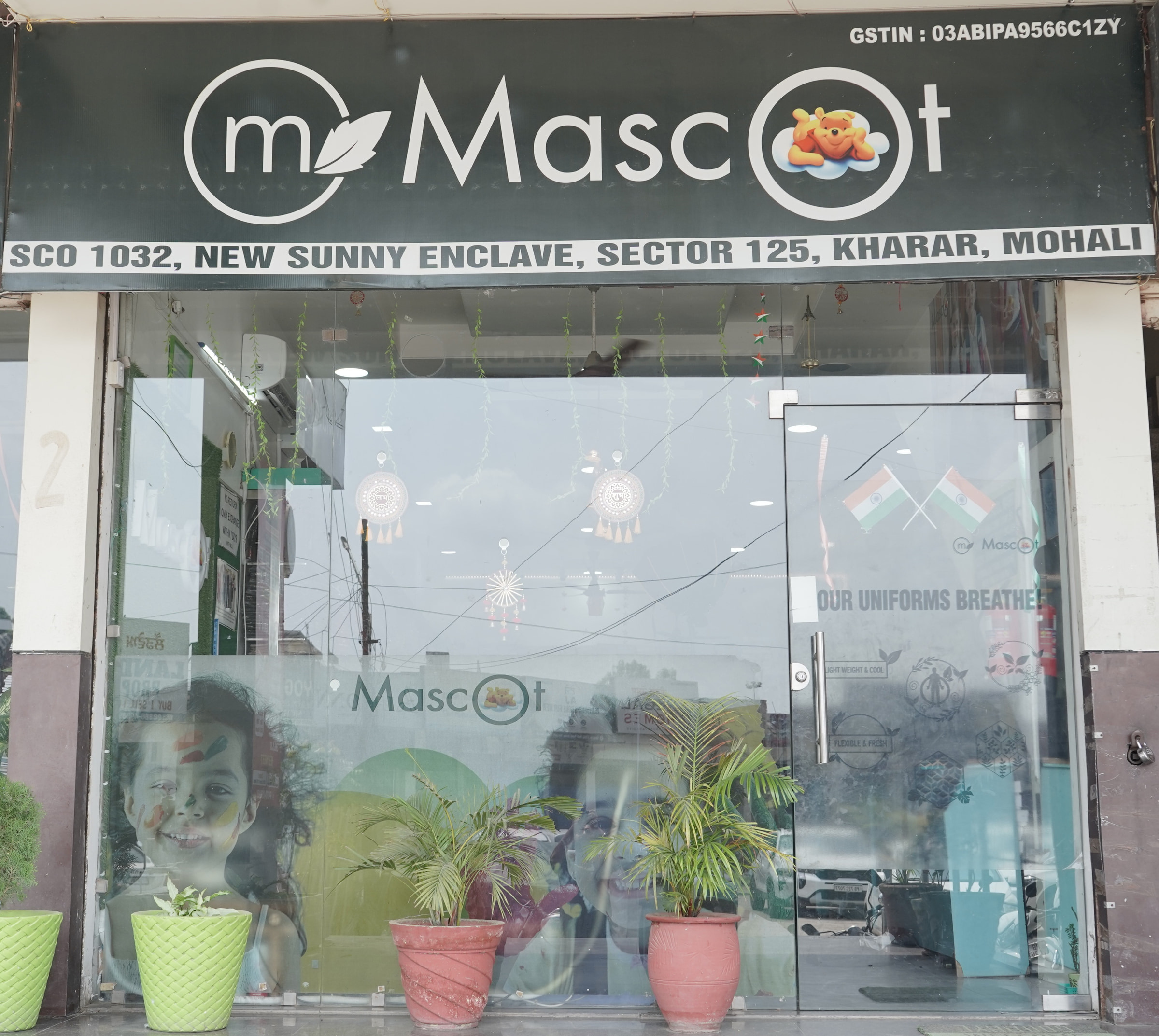 The Kharar shopfront, address board above the glass door