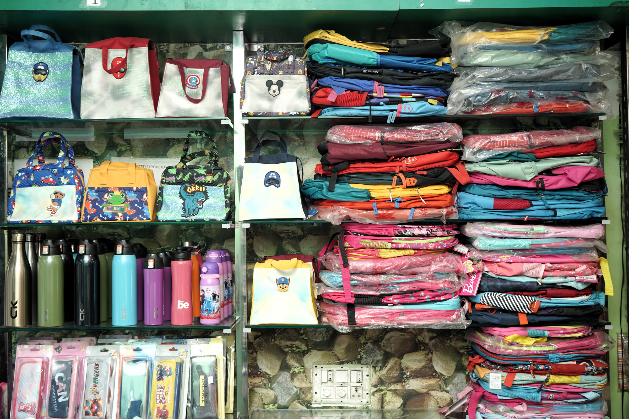 Bags, bottles and lunch boxes on the display shelf at Mohali