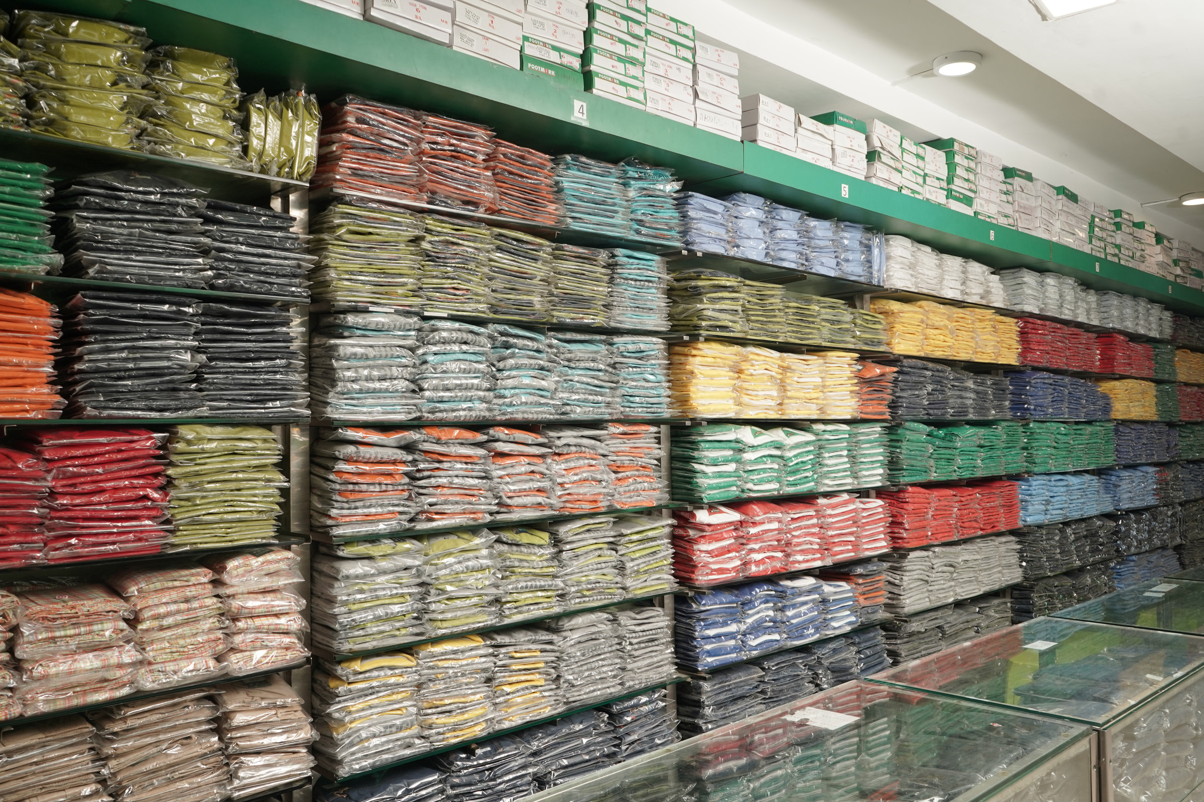 Shirts stacked by size and colour along the Mohali wall