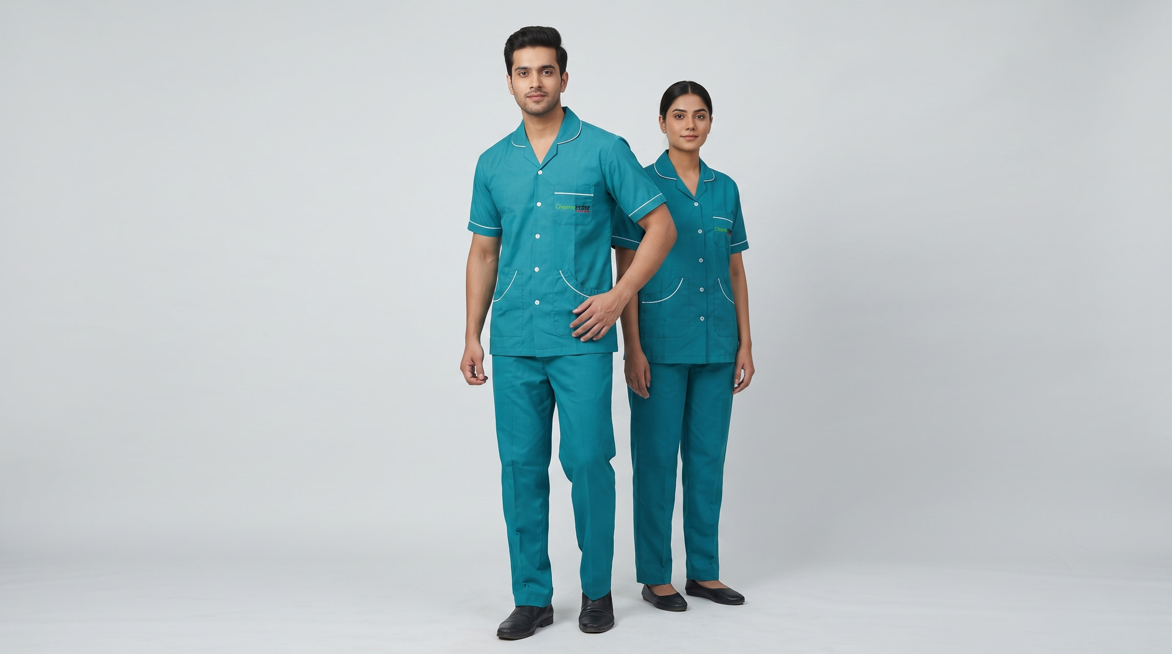 Teal scrub sets, cut loose through the shoulder and short in the sleeve for scrubbing in.